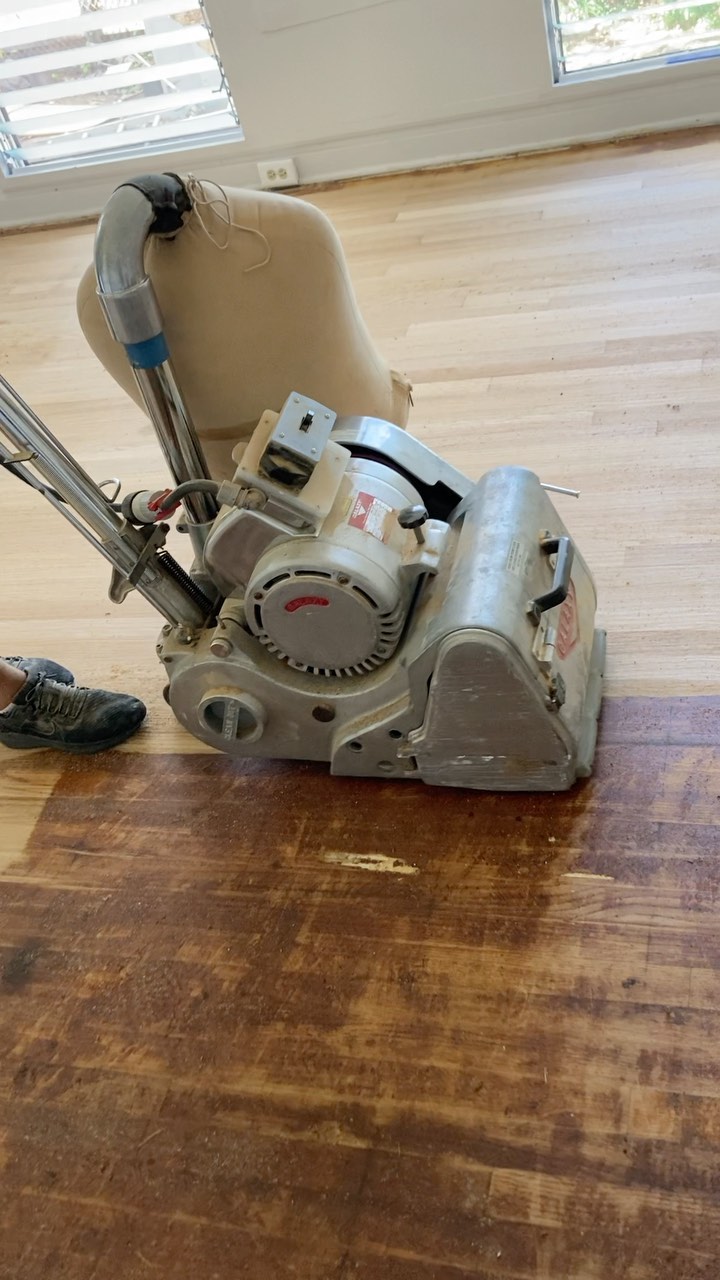 Floor sanding machine preparing a wood floor